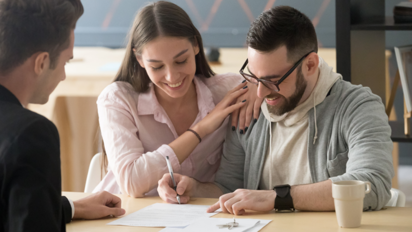 Loan Signing Agent presenting documents.